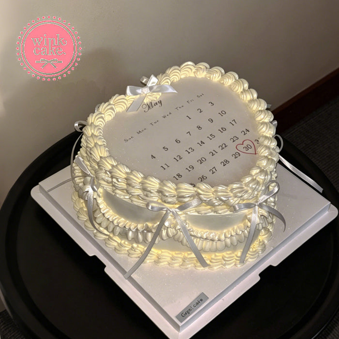 A calendar-patterned cake that can be set on fire