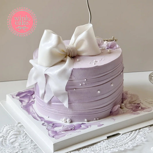 Bánh sinh nhật hình nơ tím lãng mạn WinkCake bánh cô gái