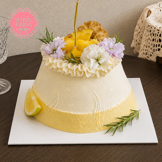 Creative tropical-themed cake combining fresh fruits and flowers.